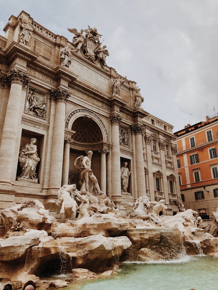 services-01 Capture the magnificence of the Trevi Fountain in Rome, showcasing intricate baroque architecture and sculptures.